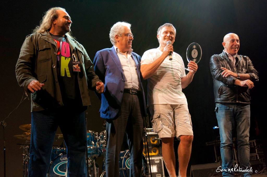 Carl Palmer receives
					award at Afrika Rock Festival. Naples, Italy